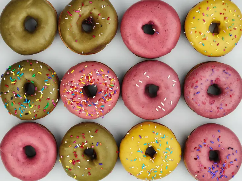 An overhead flatlay of colourful sugary desserts.