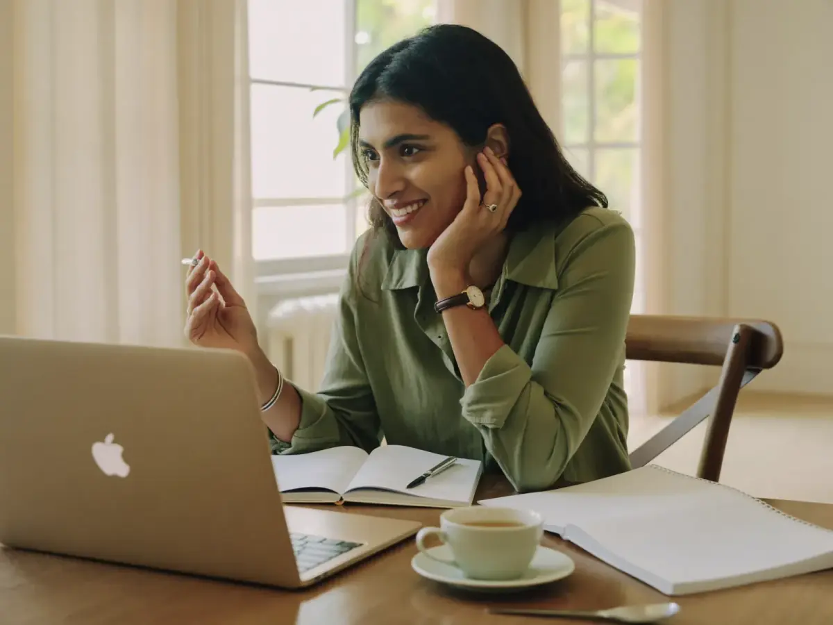 A member in a warm, relaxed intake conversation from home.